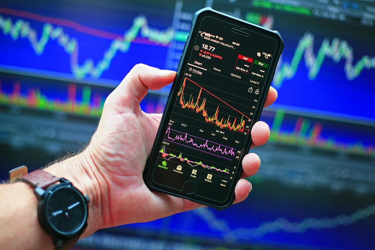 Entrepreneurs brainstorming innovative strategies to navigate the challenges posed by declining valuations in the tech industry