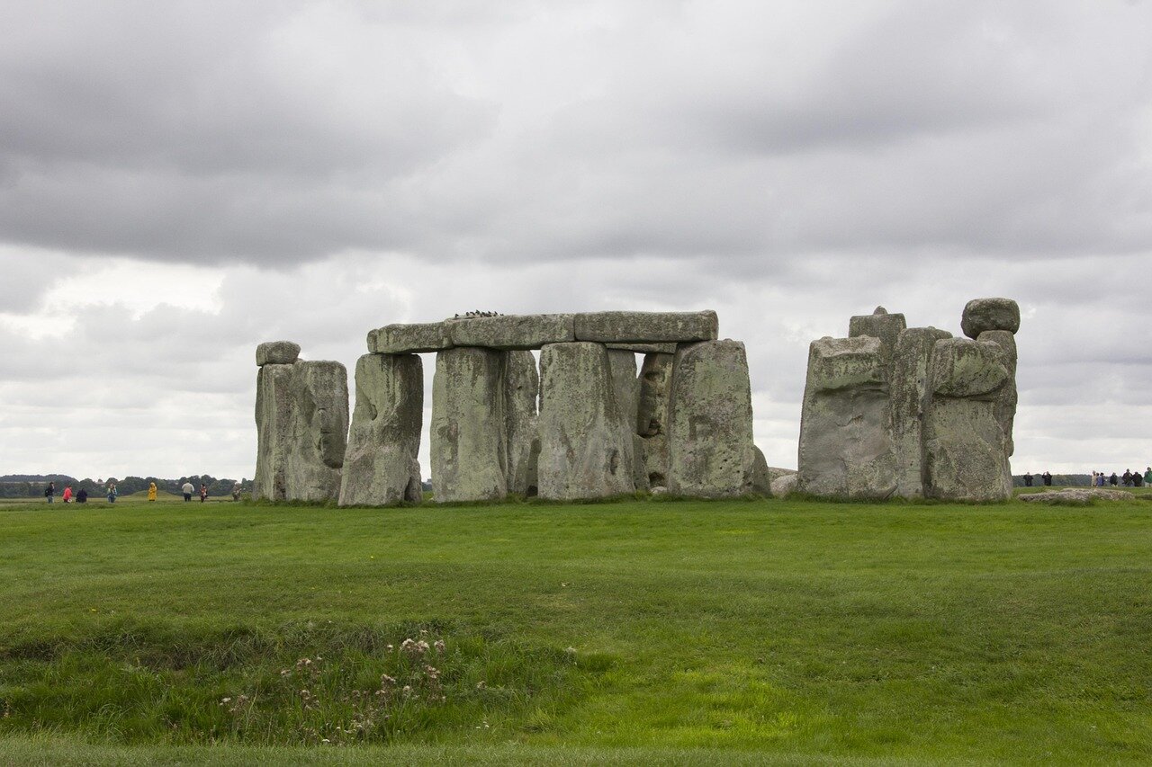 Closeup of a standing stone, highlighting the weathered surface and markings that reflect the passage of time and human interaction