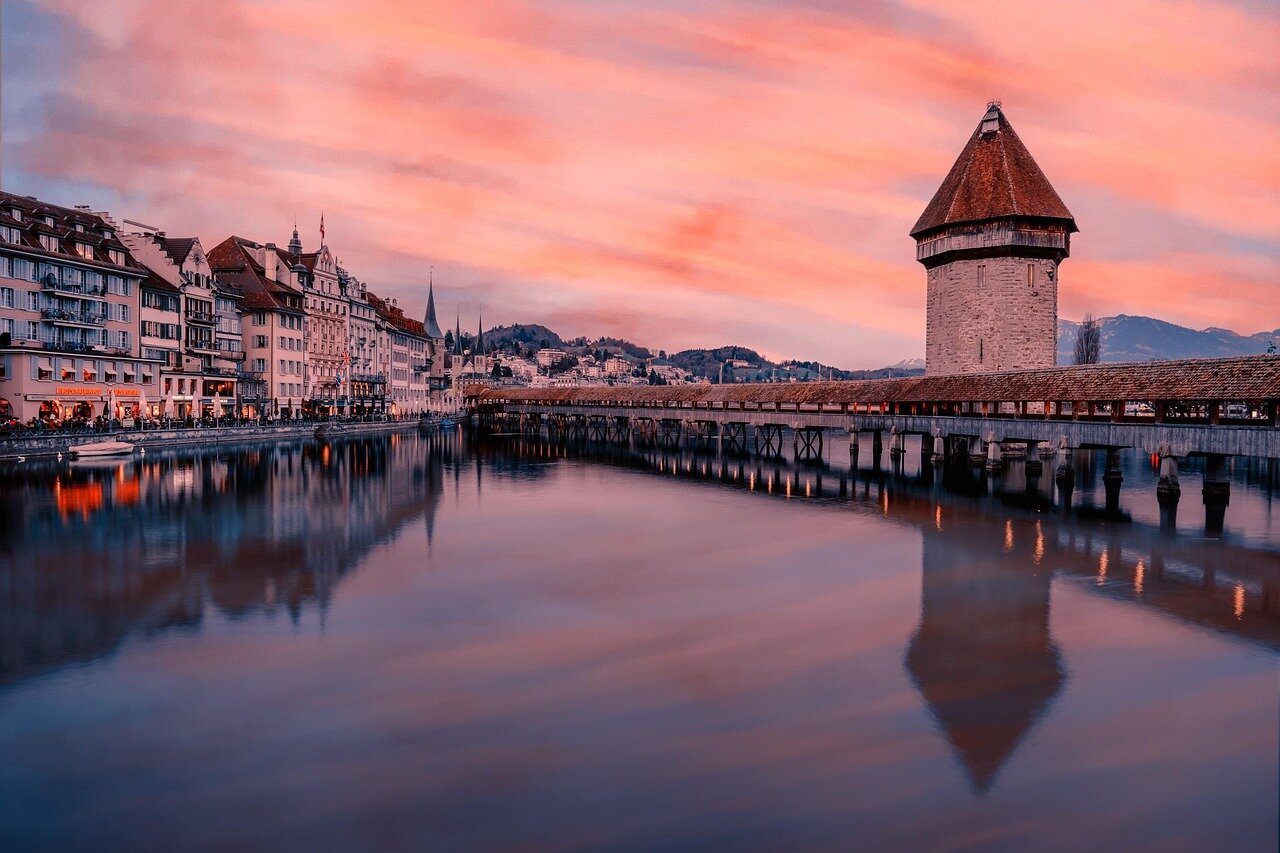 A group of filmmakers and industry professionals gather at a press conference in Switzerland to discuss the launch of The Indies, a new distribution board focused on independent films.