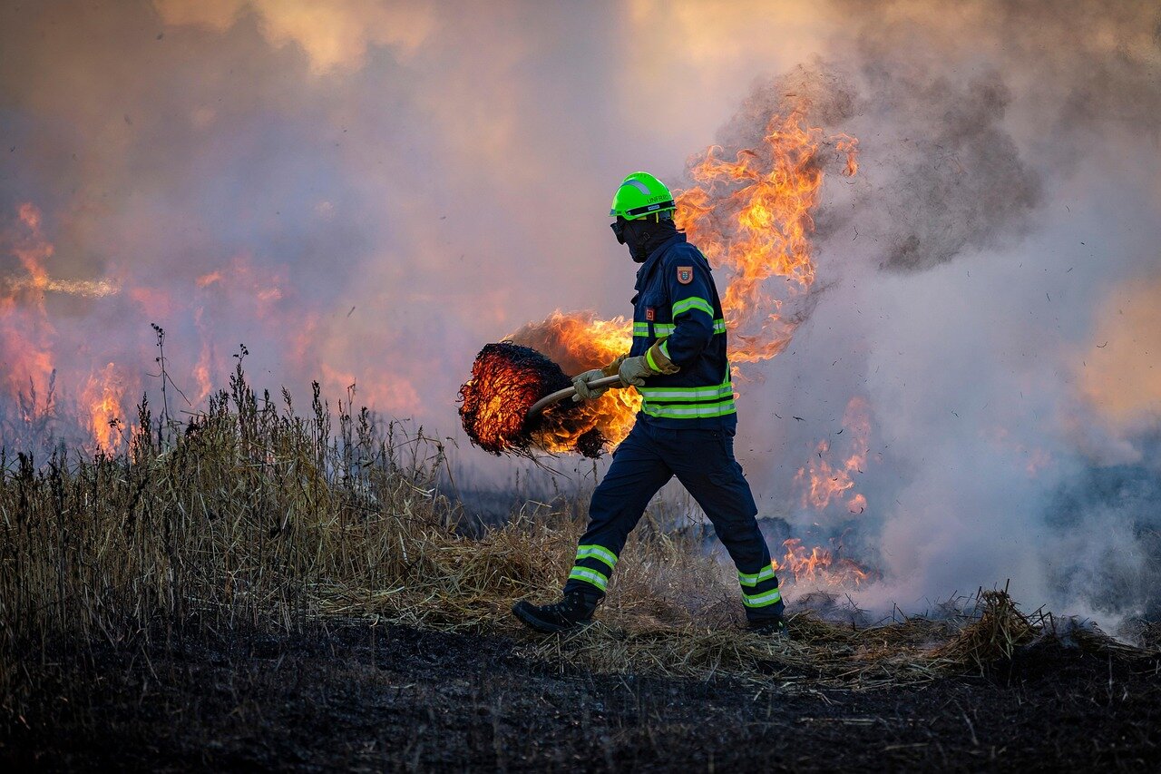 Residents engaging in recovery efforts after losing their homes to the wildfires, showcasing the emotional and social toll on affected communities