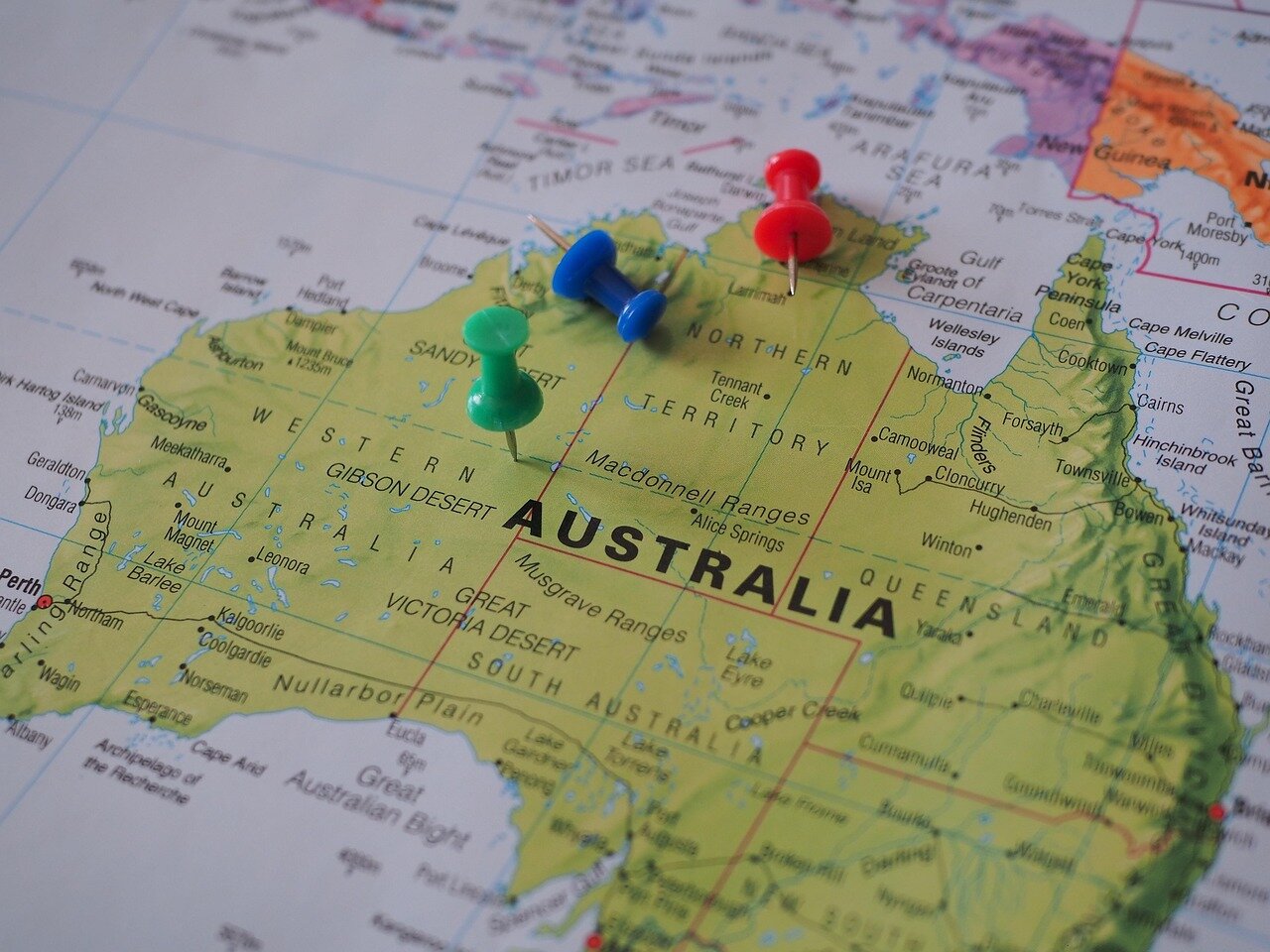 Members of the Australian public expressing their opinions on social media, showcasing a range of reactions to the comments made by their Prime Minister regarding a beloved cultural icon