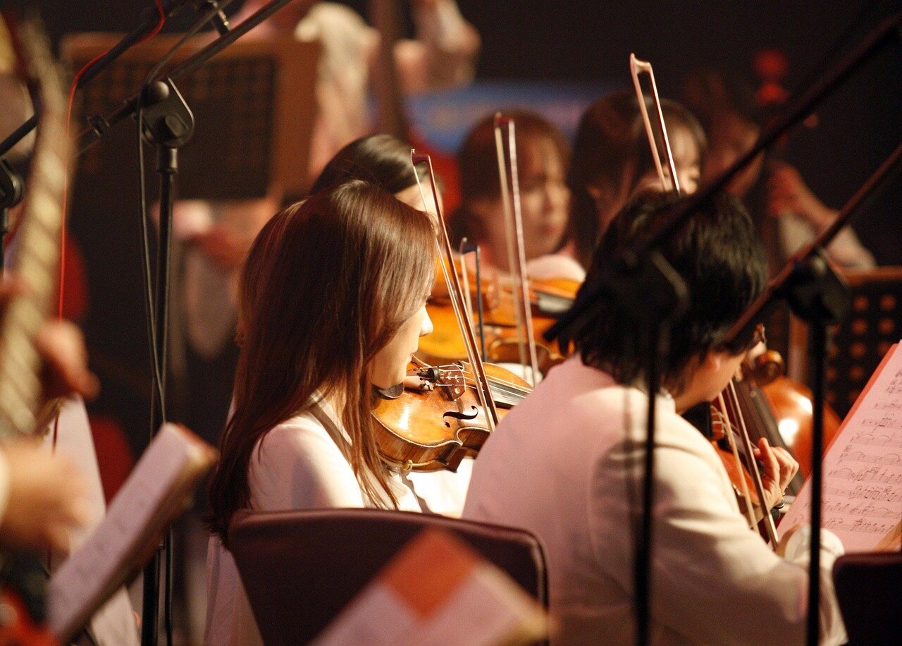 The vibrant atmosphere of a packed venue during a performance, as the audience enthusiastically responds to the band's unique sound and improvisational style