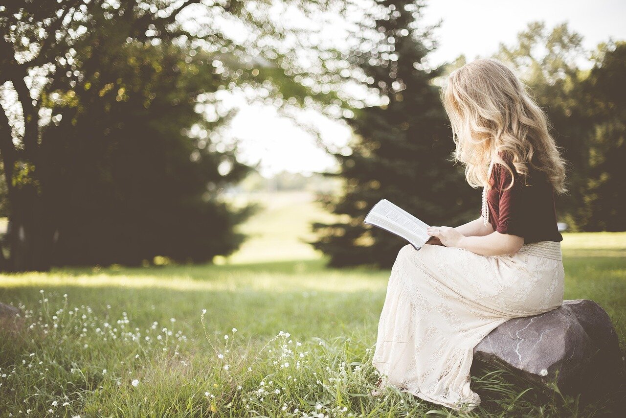 Attendees at a vibrant literary festival participate in workshops and discussions, exploring new ideas and narratives that influence their reading choices