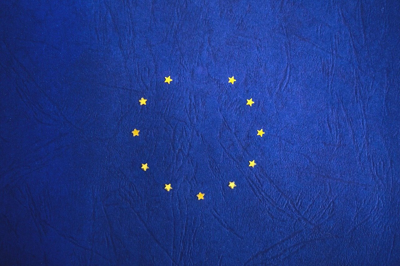 A business owner reviewing documents and trade agreements, reflecting the uncertainty of navigating postBrexit market conditions