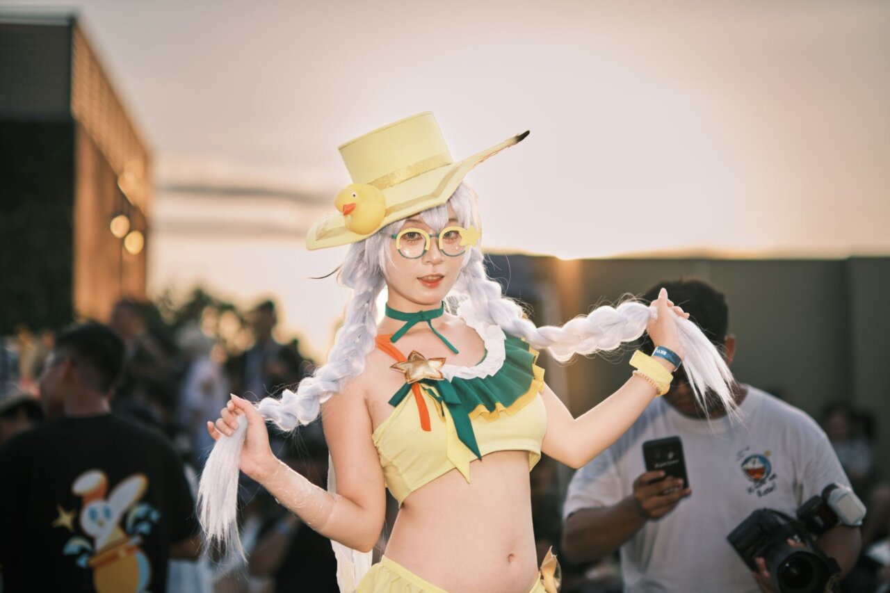 A vibrant scene of fans dressed in elaborate cosplay, embodying their favorite anime characters and enhancing the festive atmosphere of the event