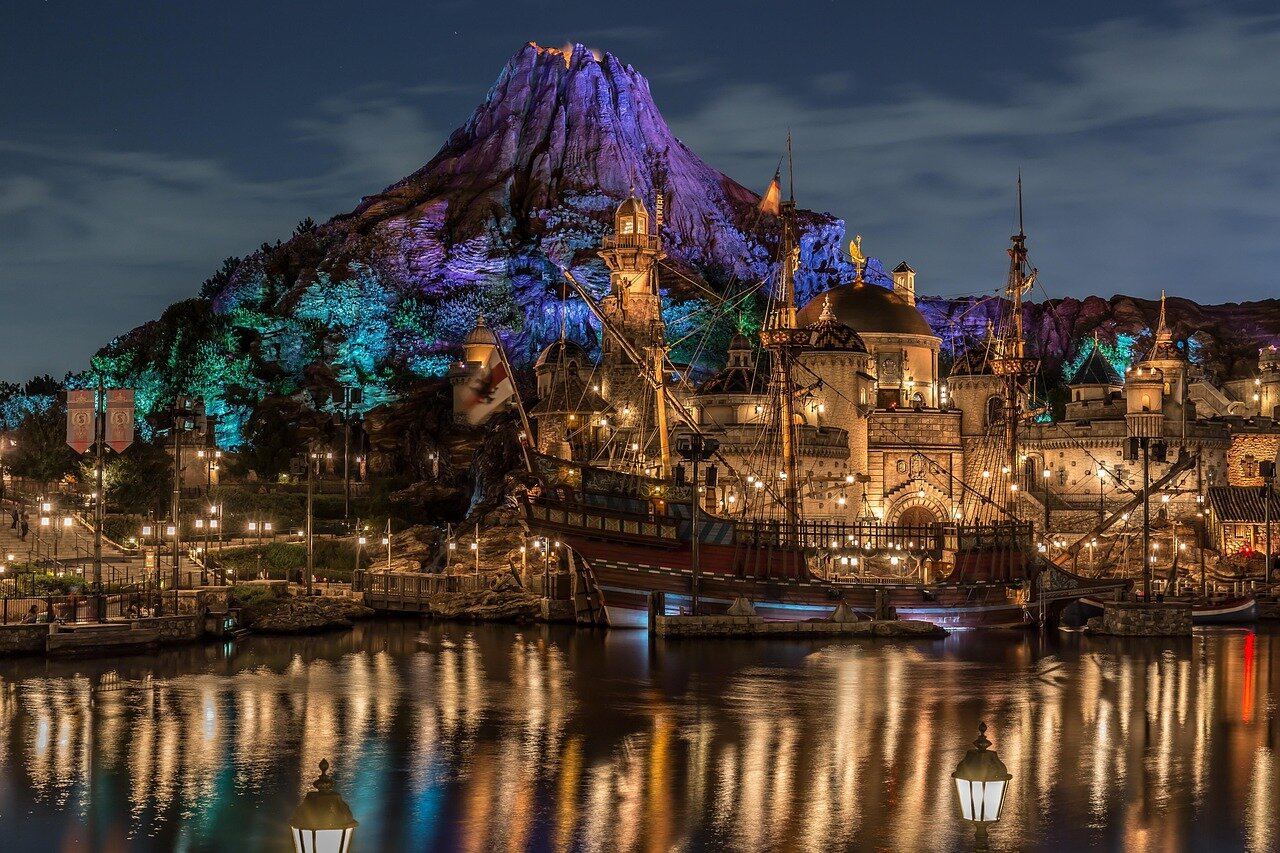 Crowds gather in front of a large stage adorned with patriotic decorations as performers rehearse for the upcoming July 4th semiquincentennial celebrations organized by Disney.