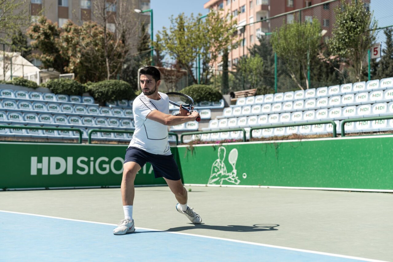 The Serbian star displays his signature focus and determination during a crucial point in the match against Tsitsipas