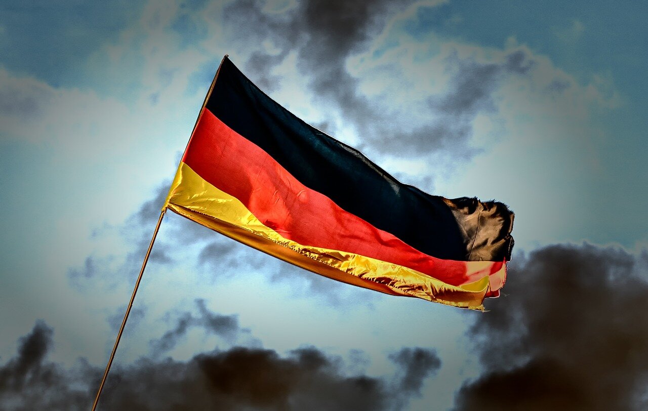 Fans in the stadium reacting with despair as Germany's chances of advancing diminish during the penalty shootout