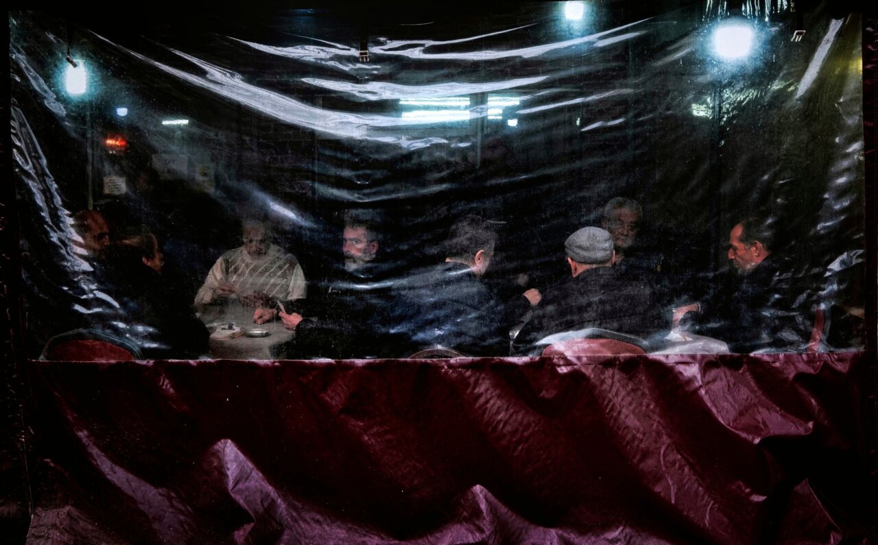 Political analysts engaging in discussions about the potential power struggles within the Iranian government following Khamenei's passing