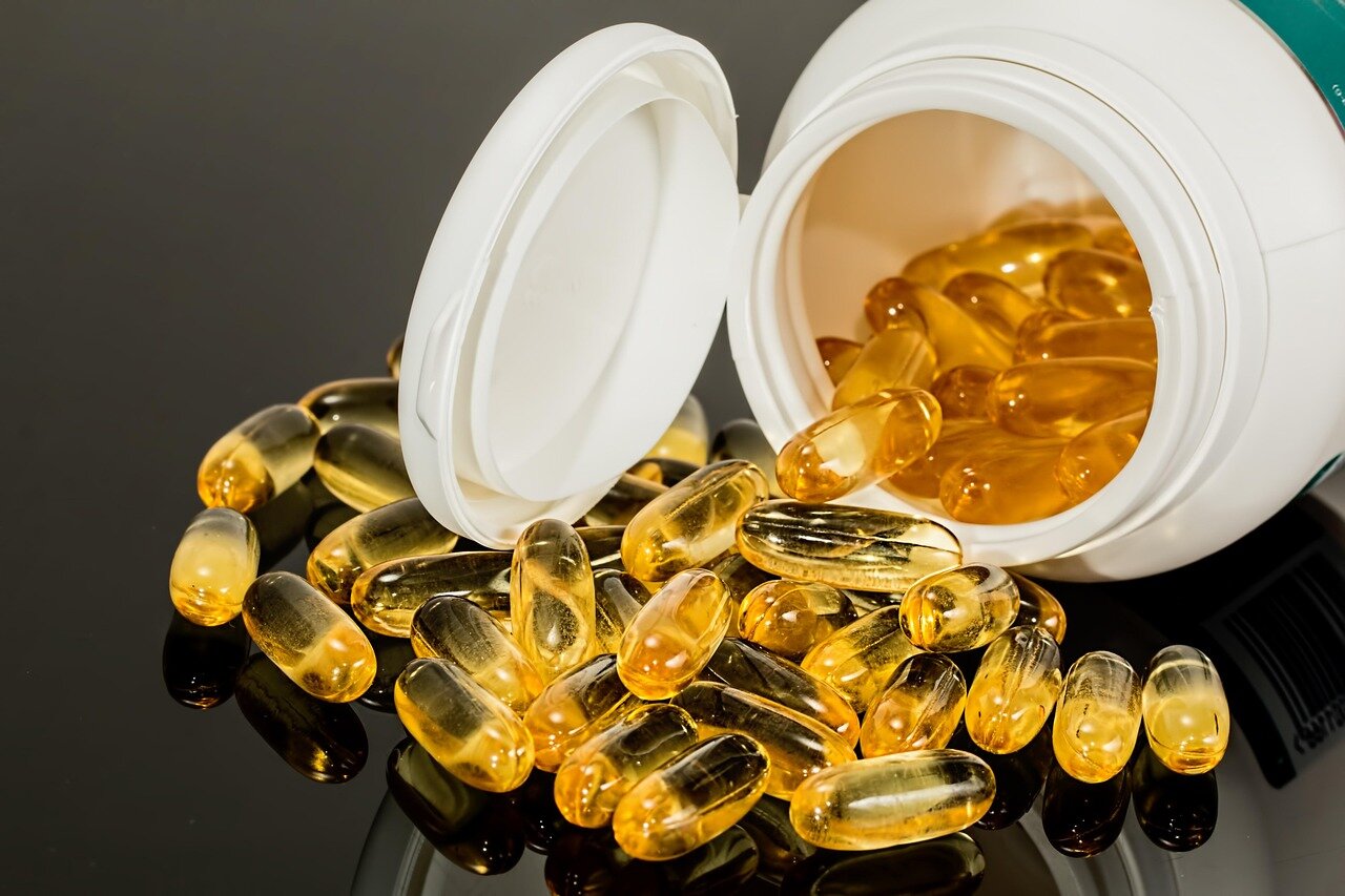 A pregnant woman attempting to manage her symptoms with natural remedies, showcasing the reliance on alternative methods due to medication accessibility issues