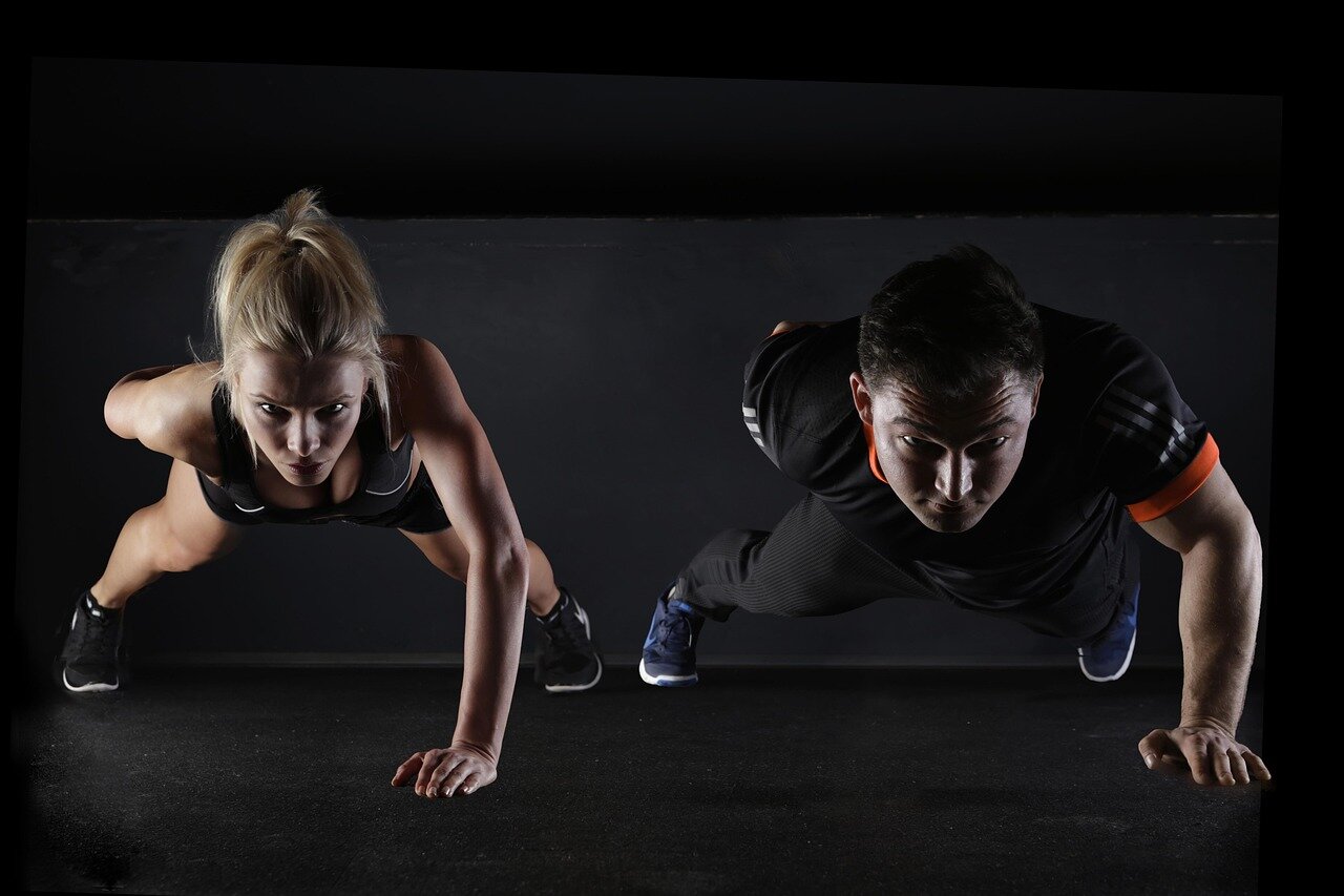 A group of middleaged adults participates in a strength training class, focusing on exercises that target the chest and back muscles to improve their overall heart health.