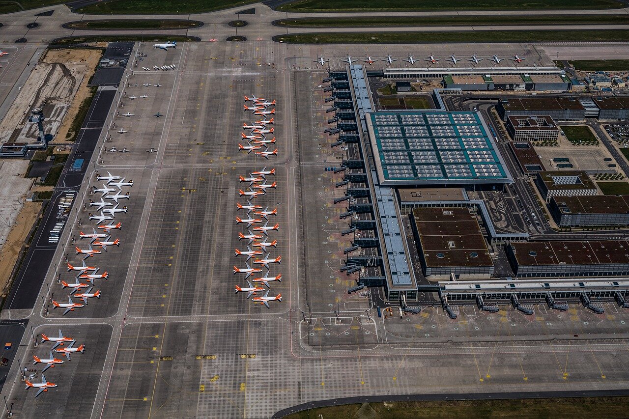 Travelers wait in long lines at an airport as they prepare for new biometric border checks being implemented by the EU.
