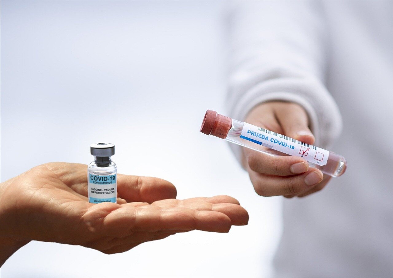 A closeup view of a healthcare worker preparing doses of the bird flu vaccine in a clinical setting, highlighting the meticulous nature of the trial process