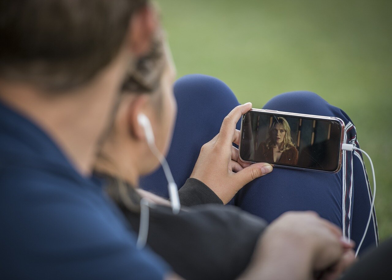 A group of concerned parents and educators gathers at a community meeting to discuss the potential impact of a controversial AI antidrug video on youth perceptions of substance use.
